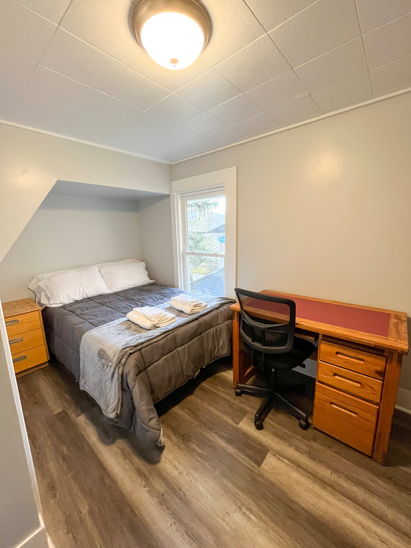 Bedroom with desk and natural light