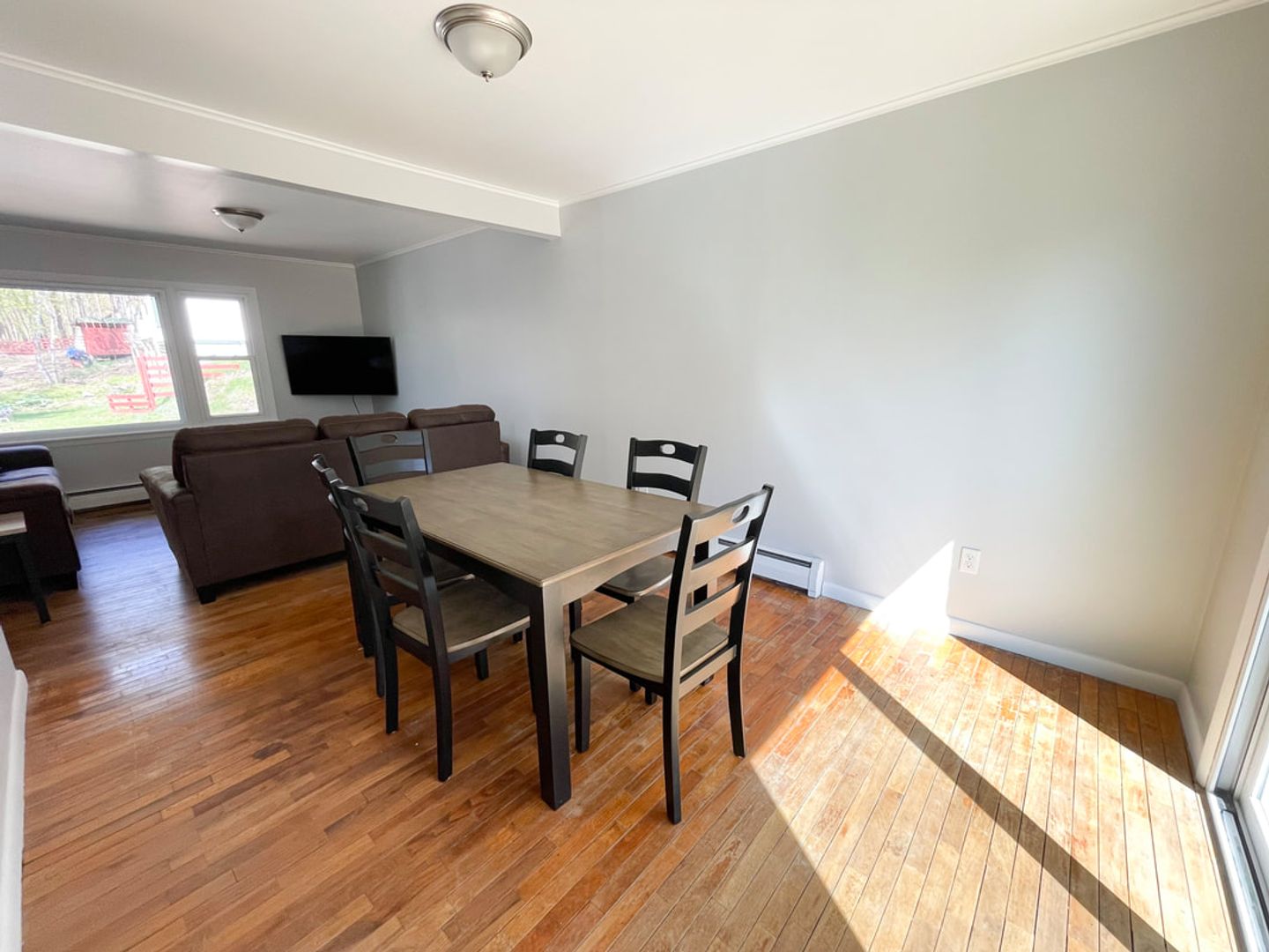 Dining area with table for six, open to living room