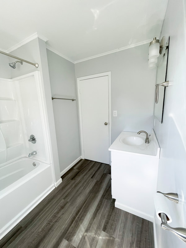 Full bathroom with vanity and walk-in shower