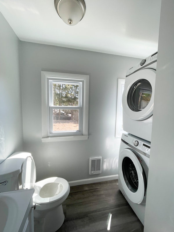 In-unit stacked washer and dryer